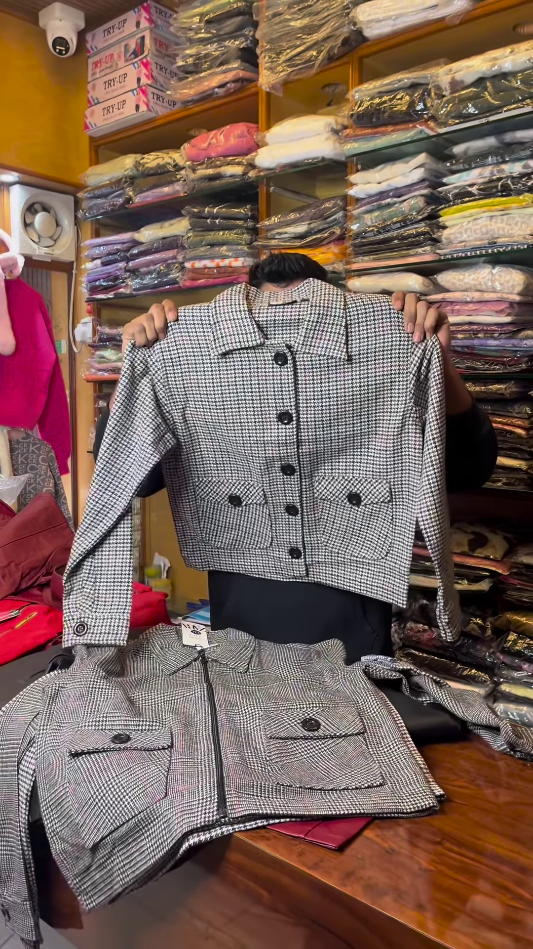 Black and White Checkered Long-Sleeve Jacket with Front Flap Pockets and Button Closure